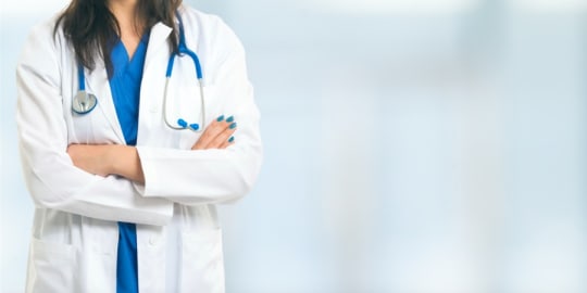 Woman doctor with arms crossed