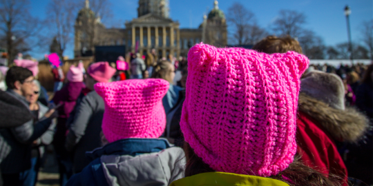 Women's March featuring "still we rise" sign