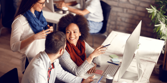 leader surrounded by employees talking