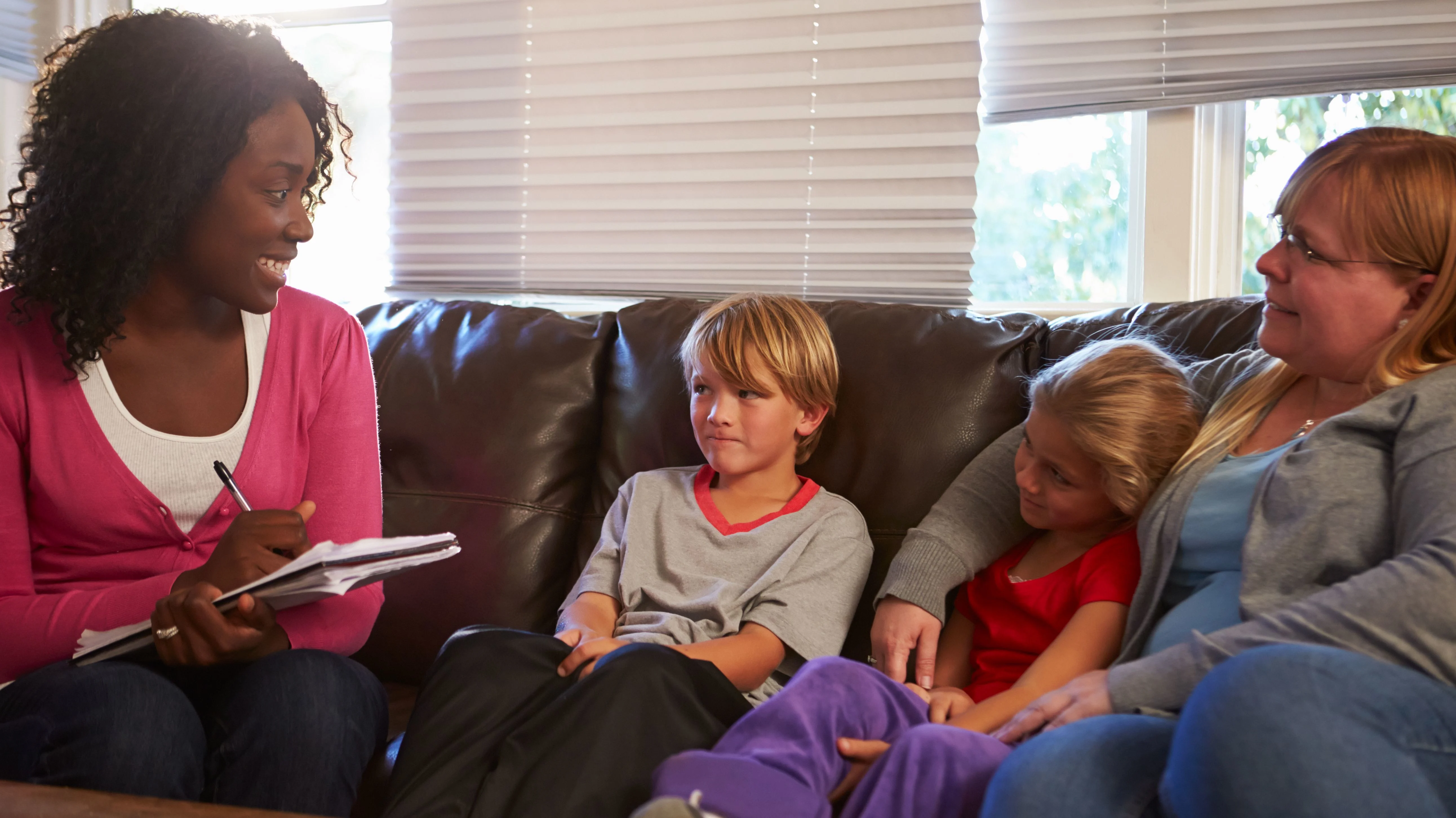 Case worker speaking with mother and children