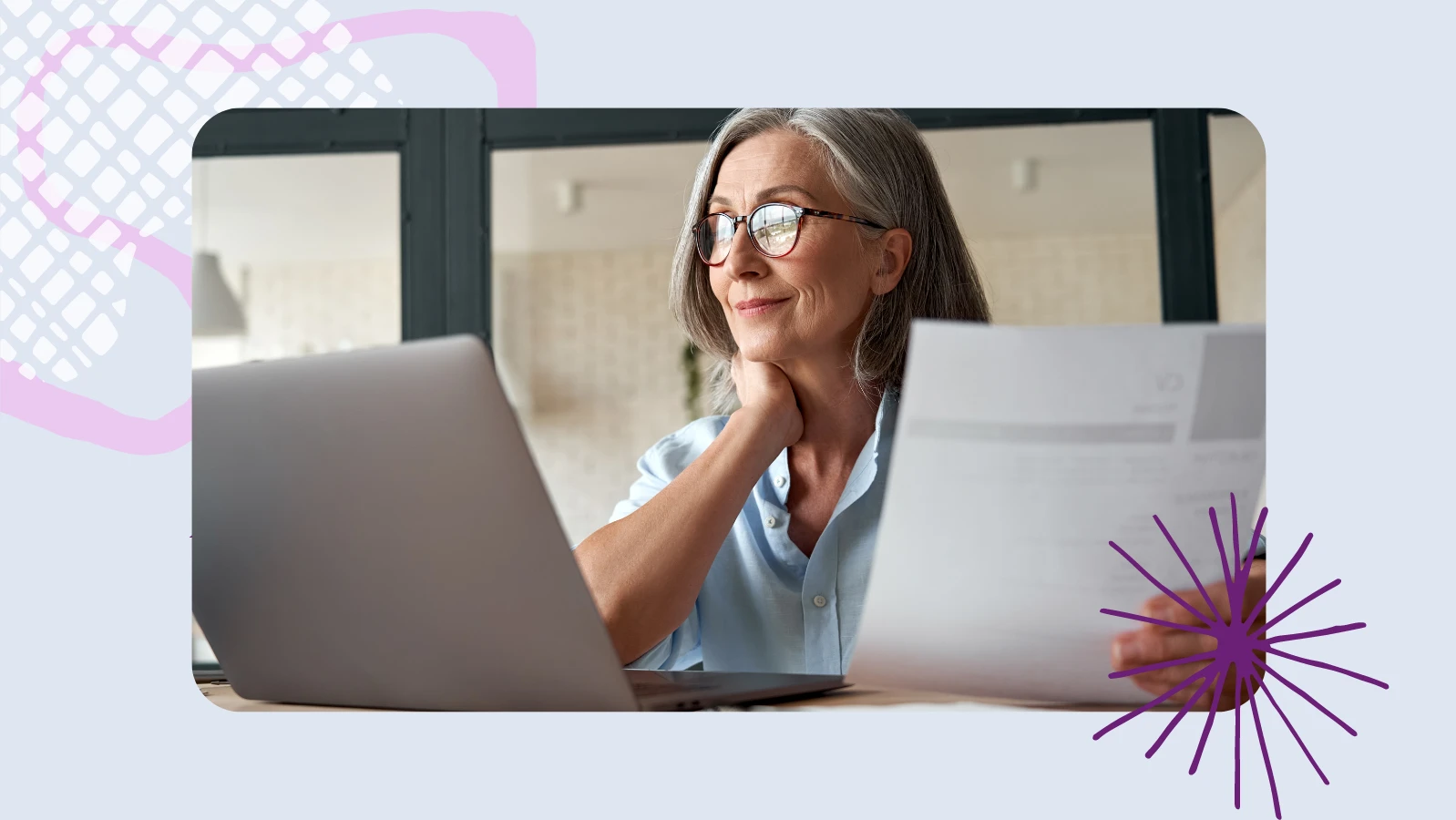 a woman working in front of a laptop