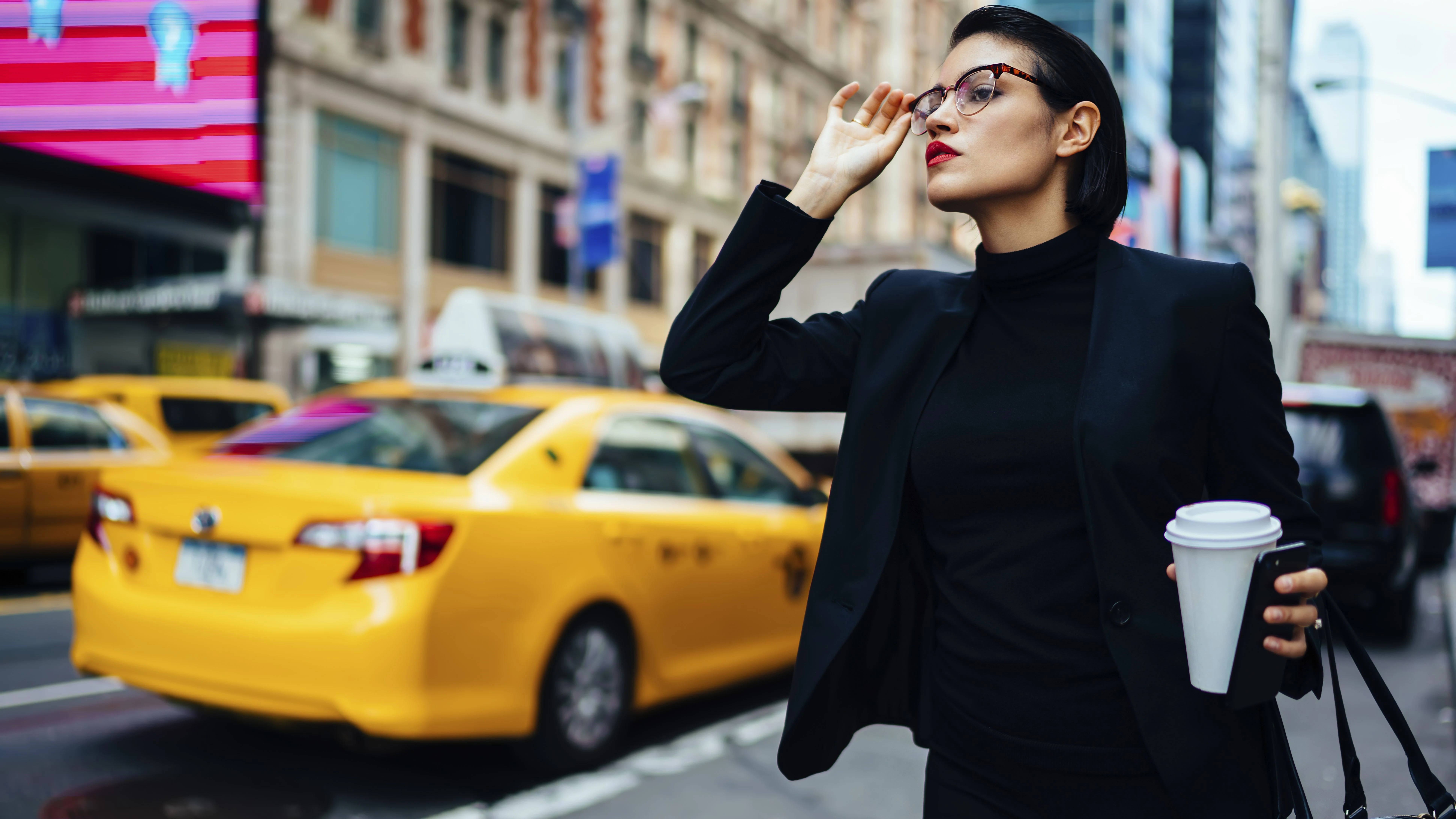 woman passing a cab on the street in New York