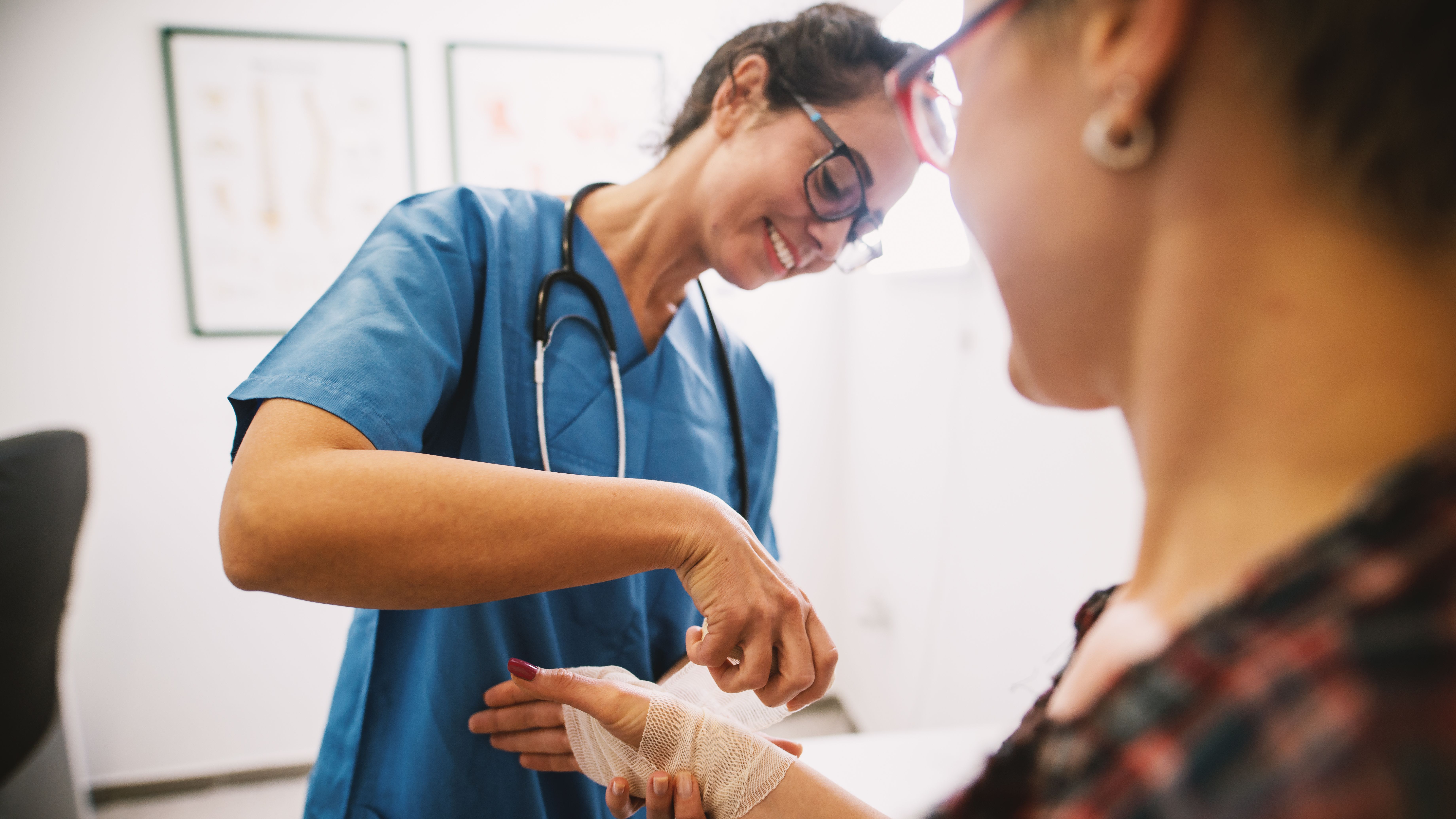 Nurse assists woman 