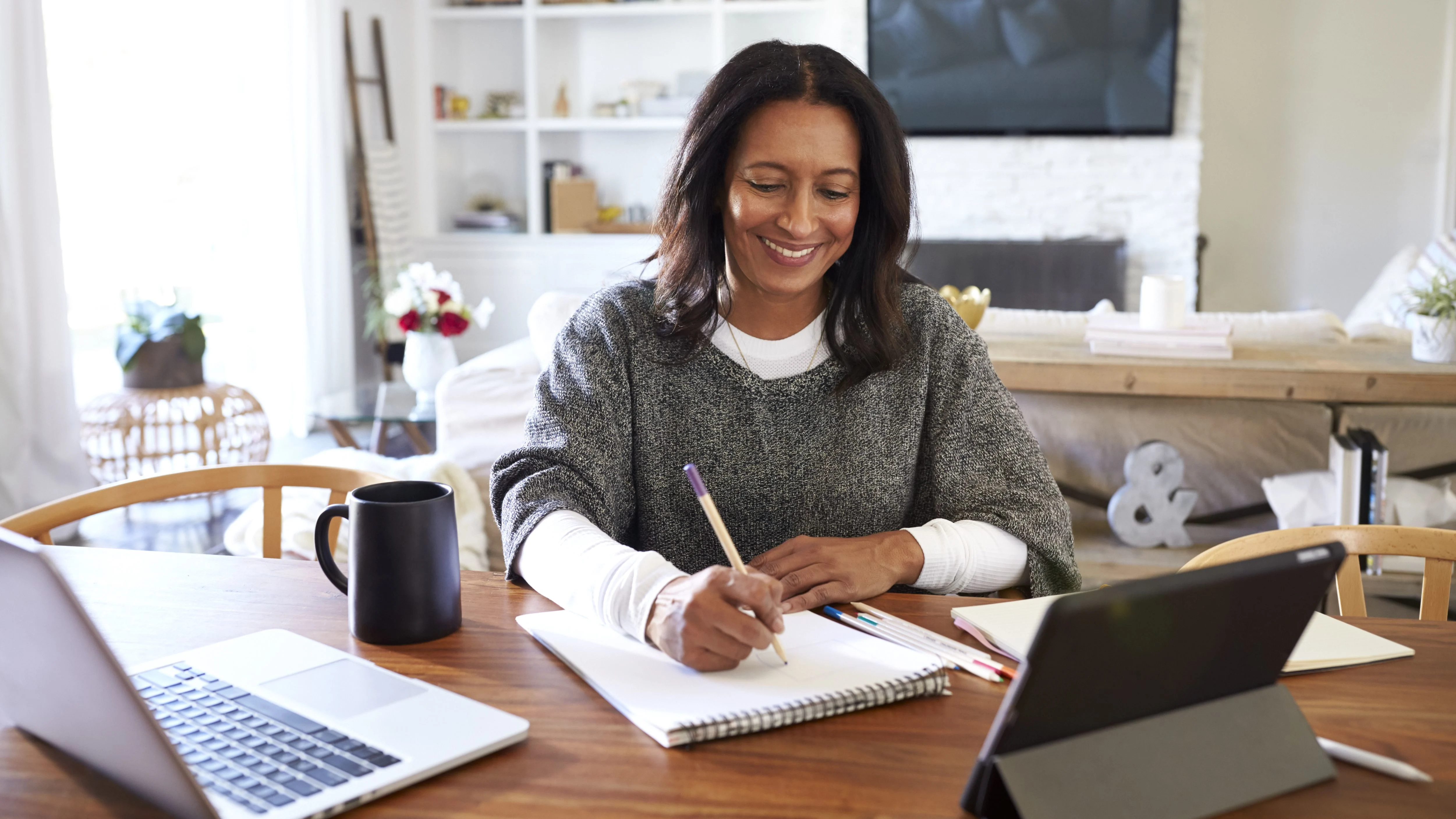 Happy woman writing