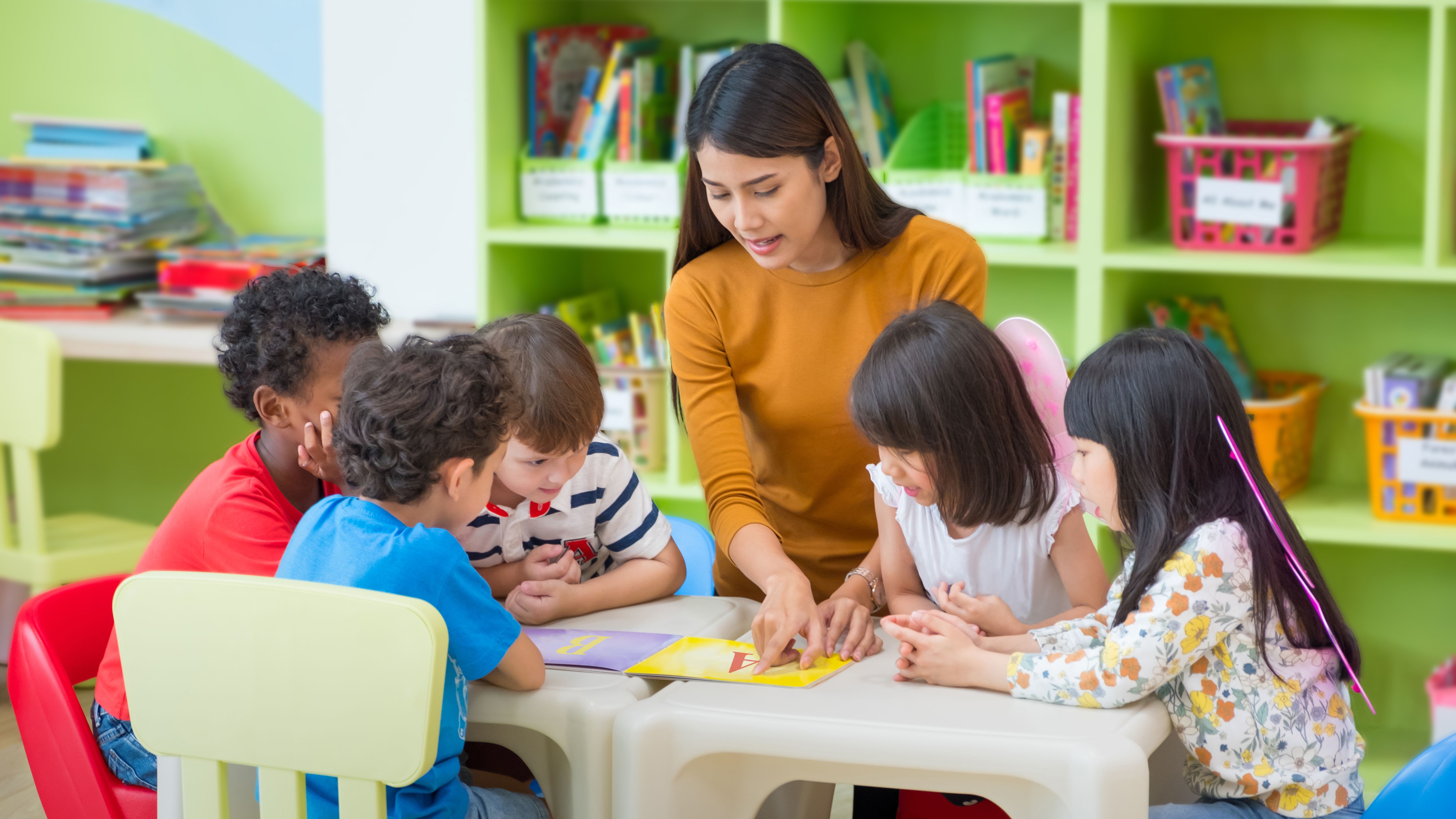 elementary school teacher with students