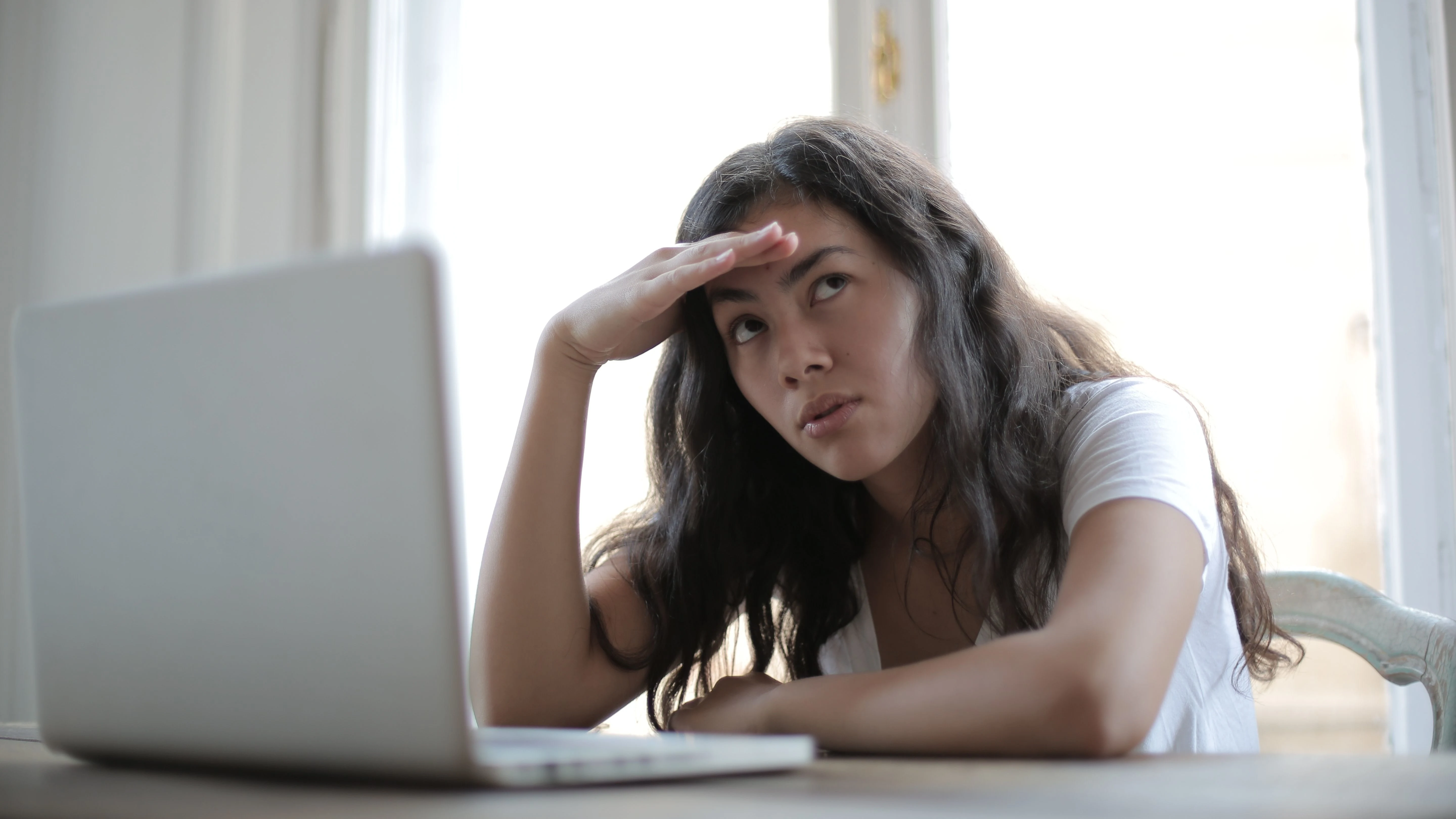woman looking bored at work