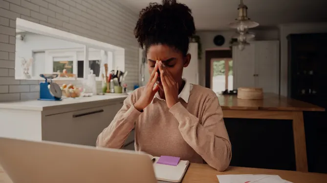 Sad woman at counter