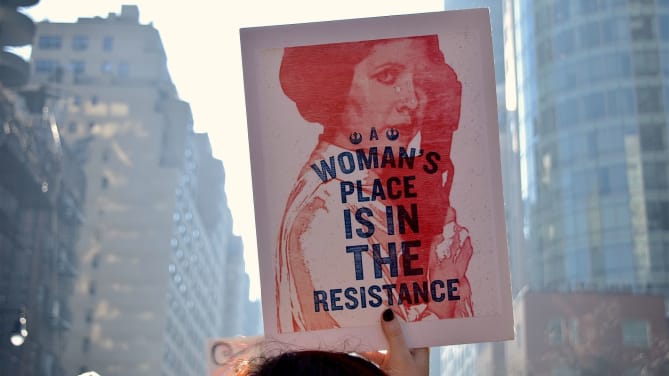 Woman holding a protest sign