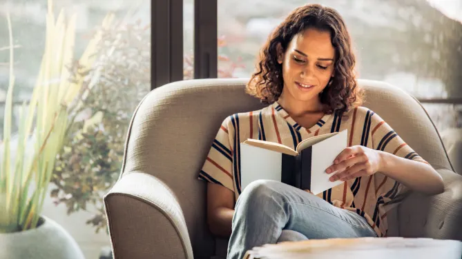 Woman reading in chair