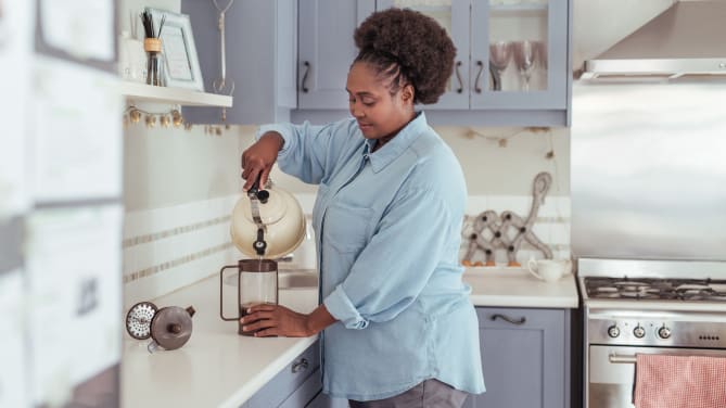 Woman making coffee