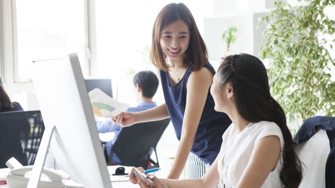Two women at work