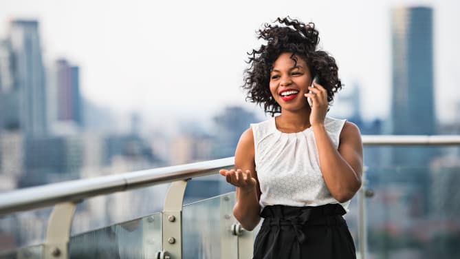 Young woman on terrace of building