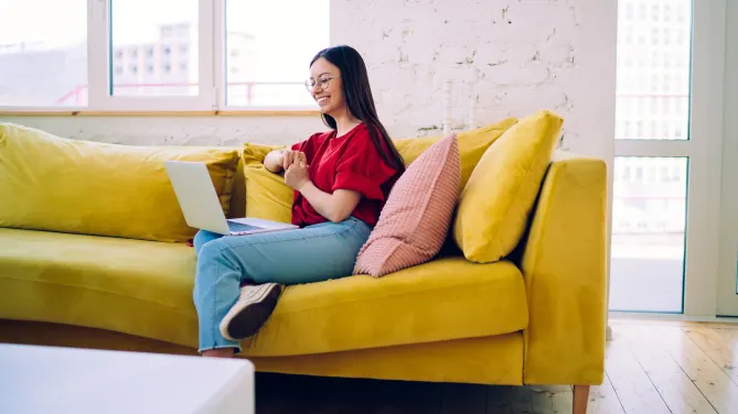 woman stands smiling