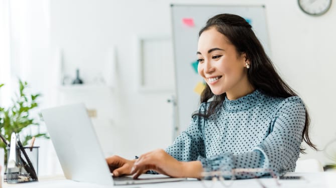 Woman typing on computer