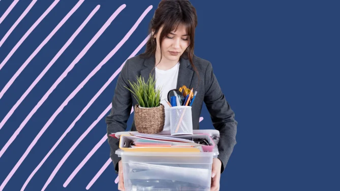 a woman packing her things from an office