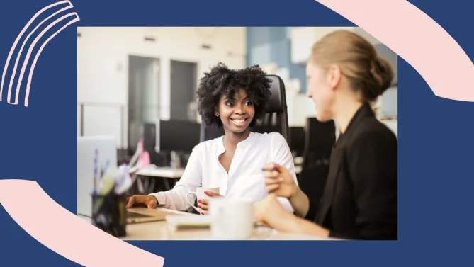 two woman having a conversation at work