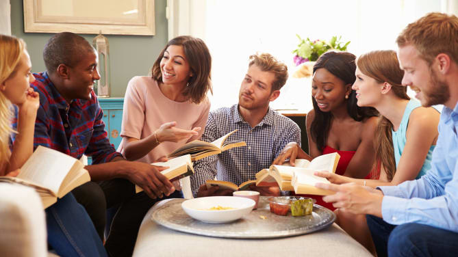 friends discussing book at a book club