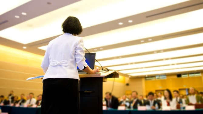 woman delivering TED talk