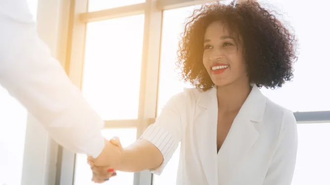 woman shaking hands