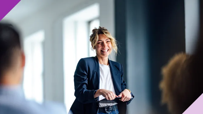 woman standing in front of colleagues
