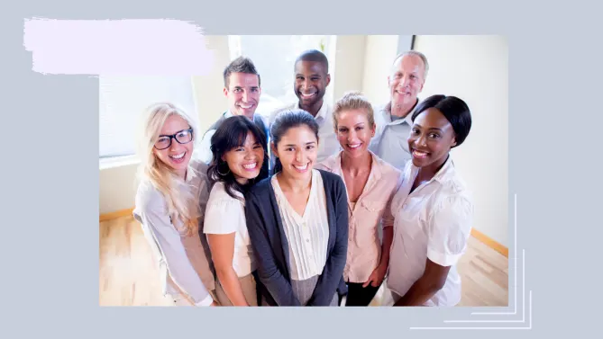 a group of employees smiling. 