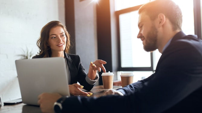 two people talking in an office