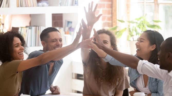 Employees high-fiving