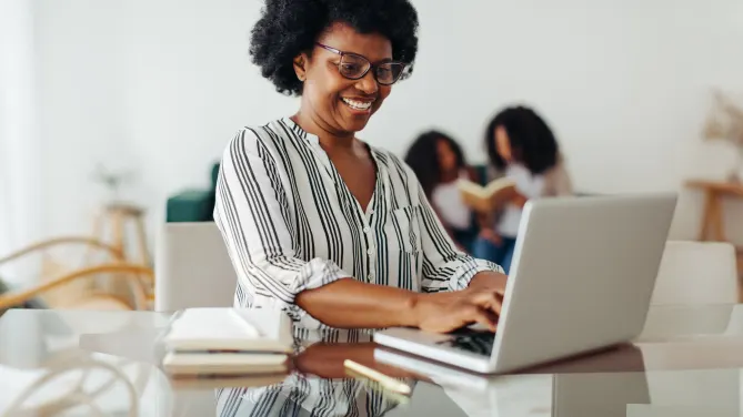 Happy woman on laptop