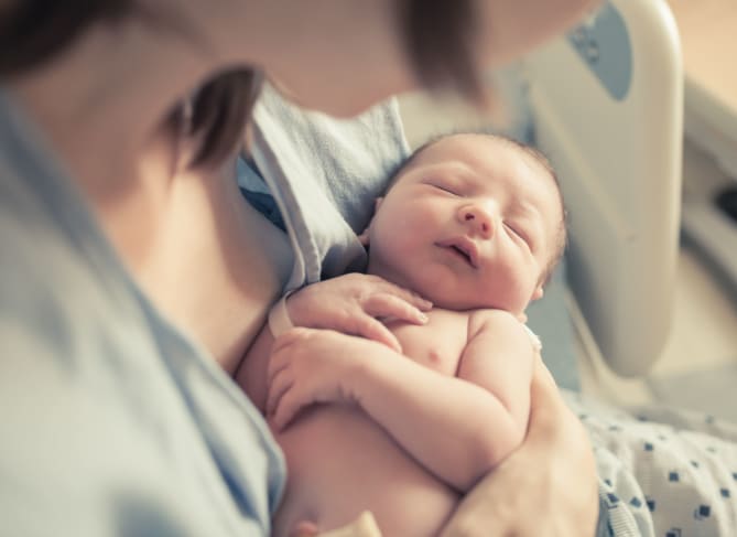 woman holding newborn