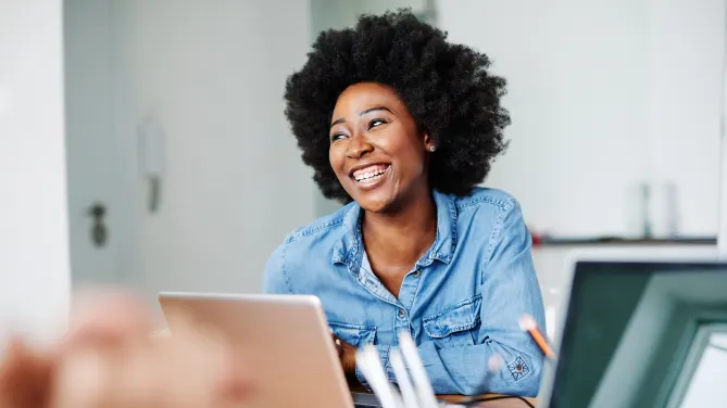 overjoyed woman on laptop