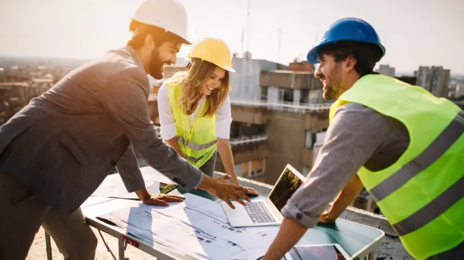 Colleagues at work in construction 