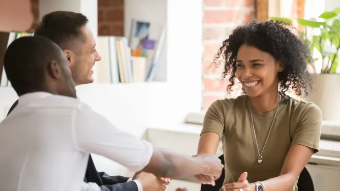 Professional woman shaking hands at work