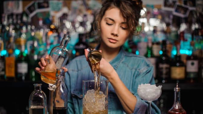 person mixing drinks
