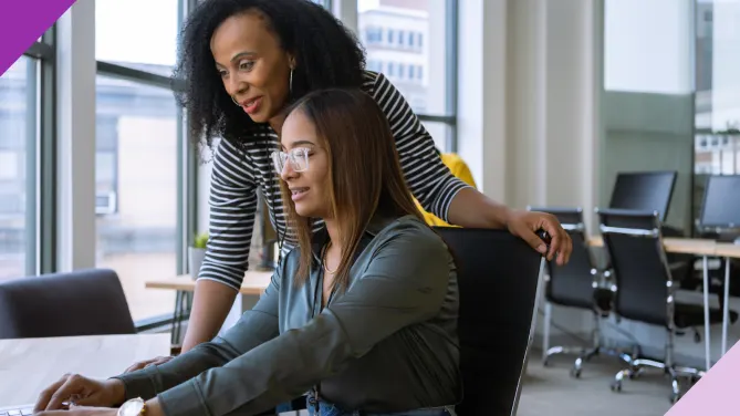woman mentoring younger employee
