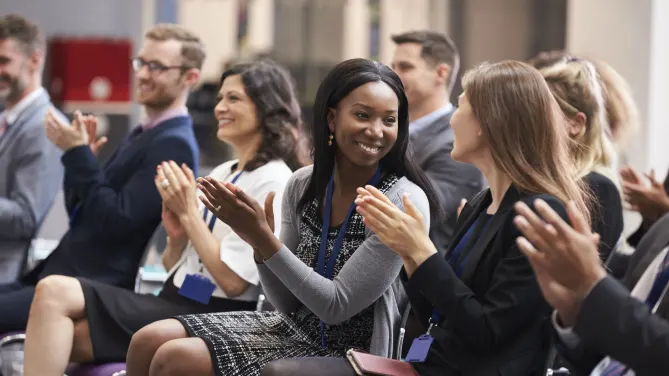 social media conference attendees clapping