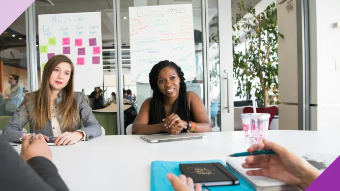 Professionals in an office setting, illustrating how to get back to work after a long break