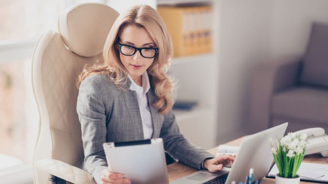 woman looking at a piece of paper