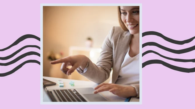 a woman looking at a laptop