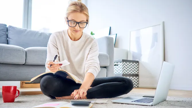 Woman with laptop and calculator