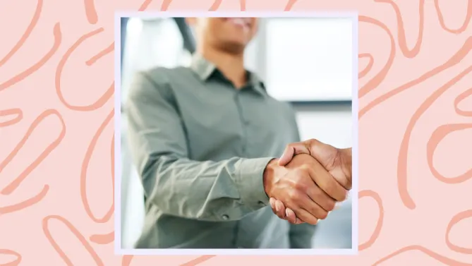 a woman shaking a person's hand