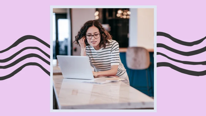 a woman on a laptop listening in on a meeting.