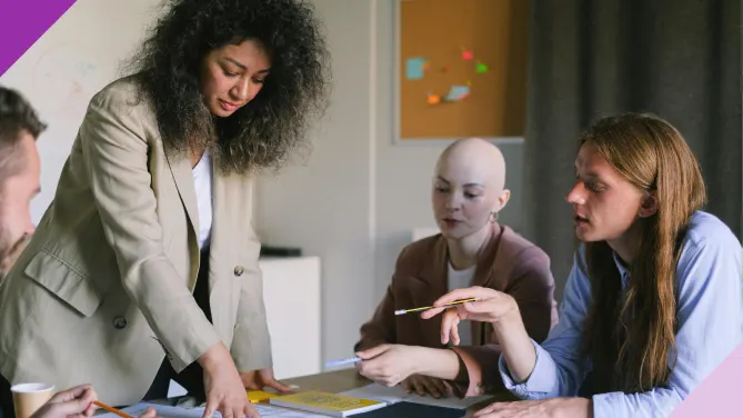 Coworkers in an office setting, illustrating how to deal with a boss who undermines you