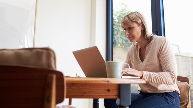 woman looking at laptop