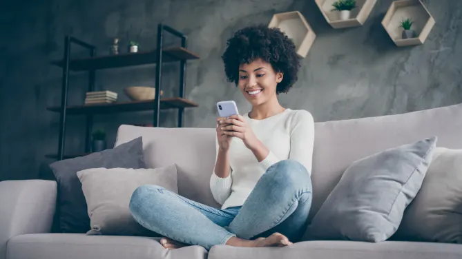 woman using Instagram on her phone