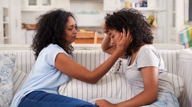 Mom comforting daughter