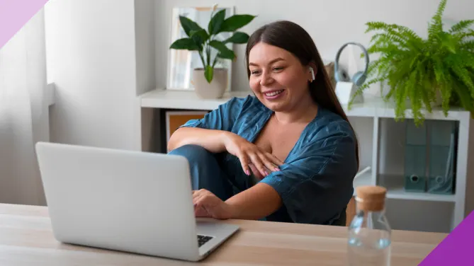 A woman comfortably working at her desk in her house to illustrate that you can find a remote job in 2025
