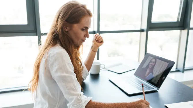 Serious woman on video call