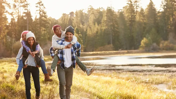 Family walking by lake
