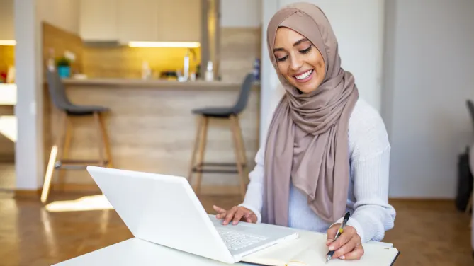 woman writing a cover letter