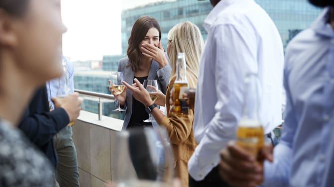 Women laughing and drinking wine